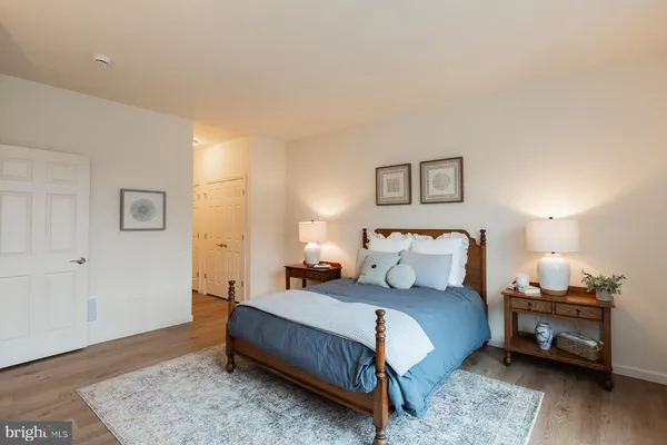 a bedroom with bed and a window