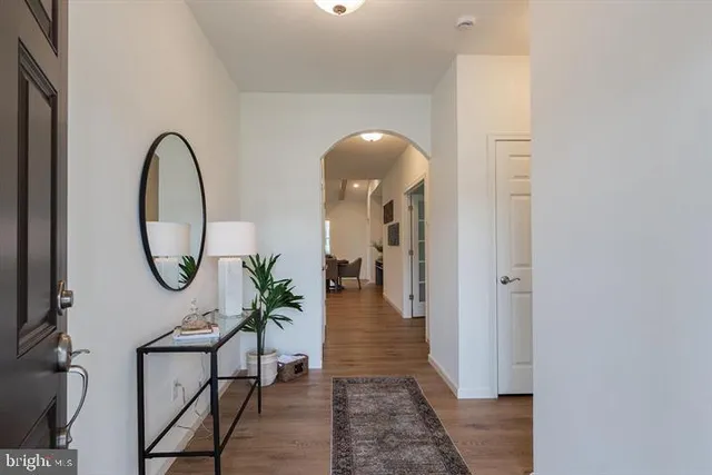 a view of a livingroom with furniture and wooden floor
