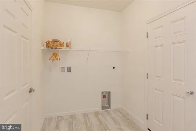 a view of storage and utility room with empty racks