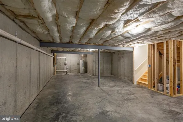 a view of an empty room with wooden walls