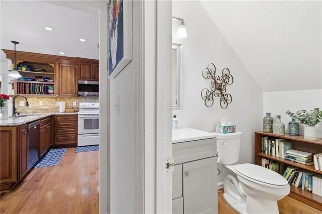 a bathroom with a sink a toilet and a shower