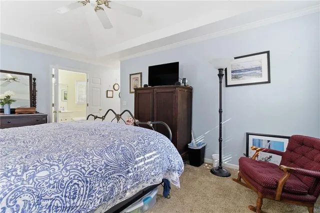 a bedroom with a bed and a television