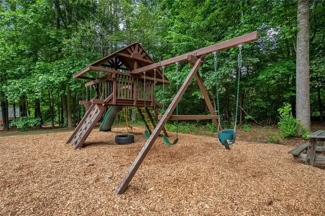 a view of a house with backyard porch and sitting area