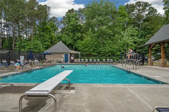 a sign that is sitting in front of flowers