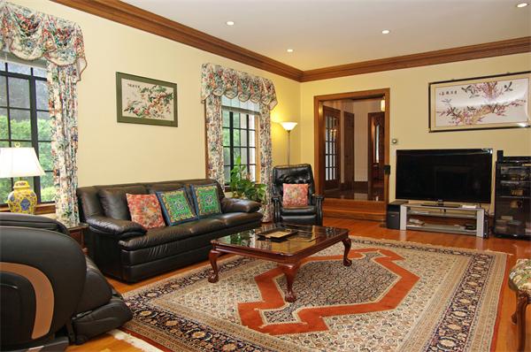 87 Hobart Road Newton, MA 02459 - Photo 5 of 22 a living room with furniture and a flat screen tv