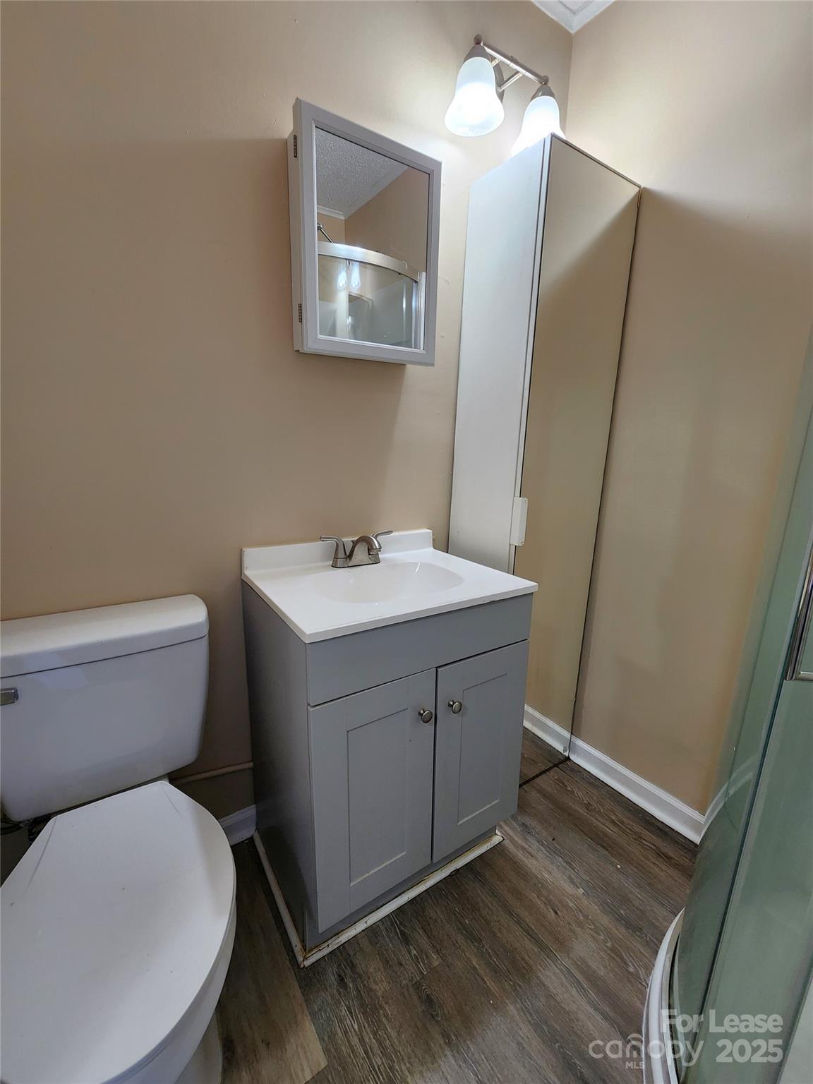 420 A Jackson Park Road Kannapolis, NC 28083 - Photo 13 of 20 a bathroom with a toilet sink and mirror