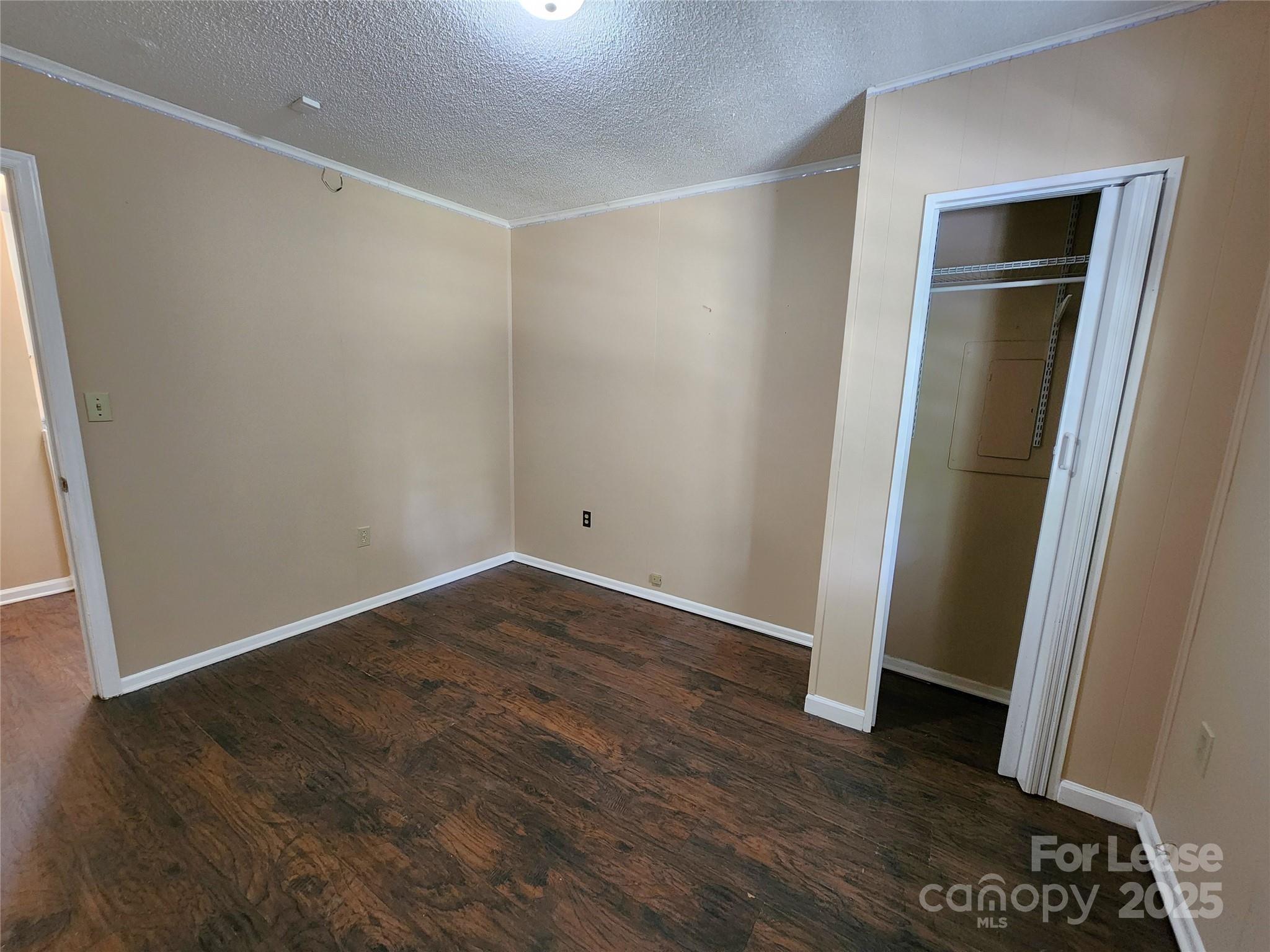 420 A Jackson Park Road Kannapolis, NC 28083 - Photo 17 of 20 an empty room with wooden floor and closet