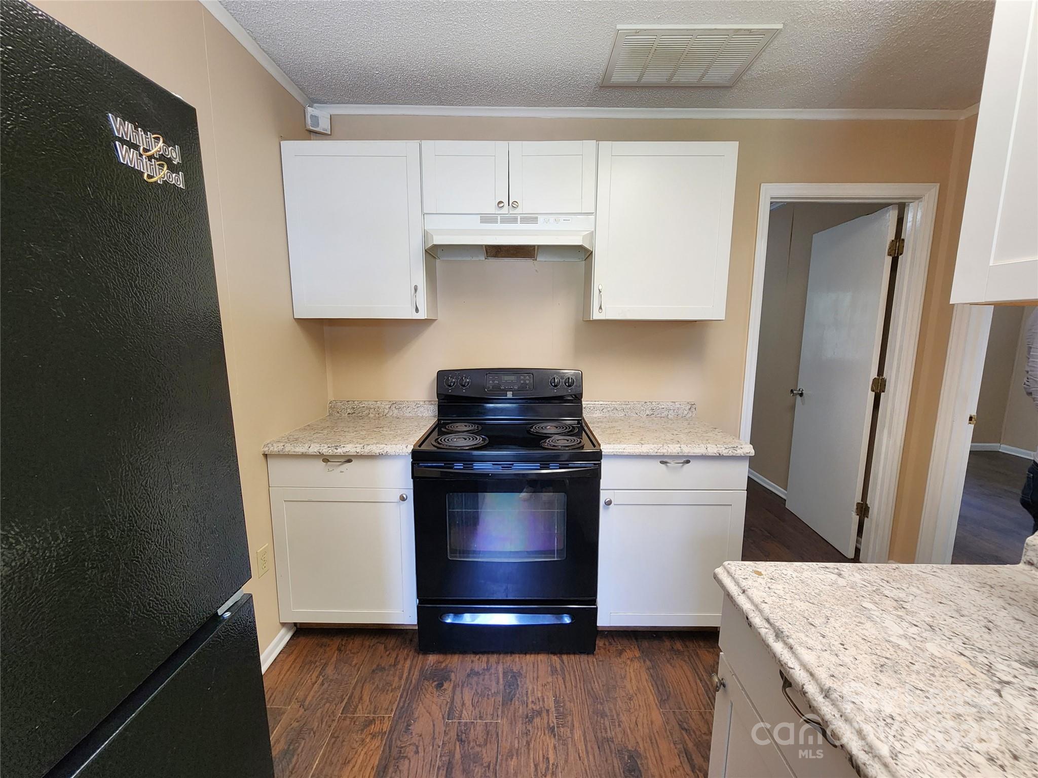 420 A Jackson Park Road Kannapolis, NC 28083 - Photo 4 of 20 a kitchen with a stove and a refrigerator