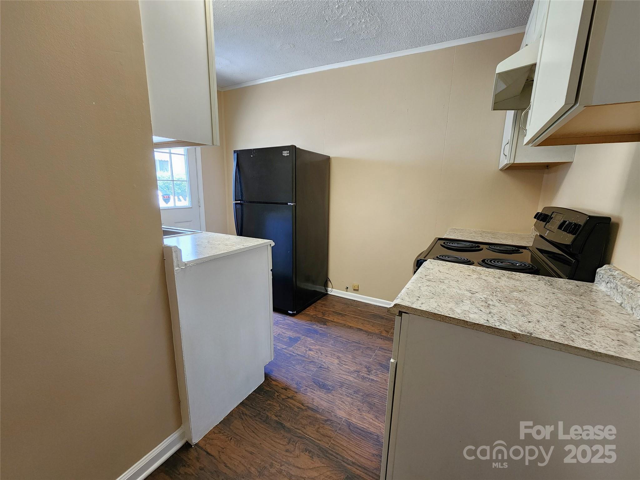 420 A Jackson Park Road Kannapolis, NC 28083 - Photo 8 of 20 a kitchen with a refrigerator and a stove