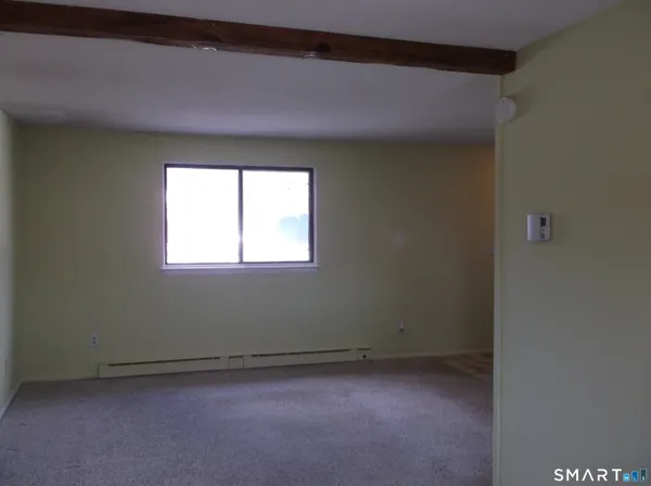 a view of a room that has a window in it