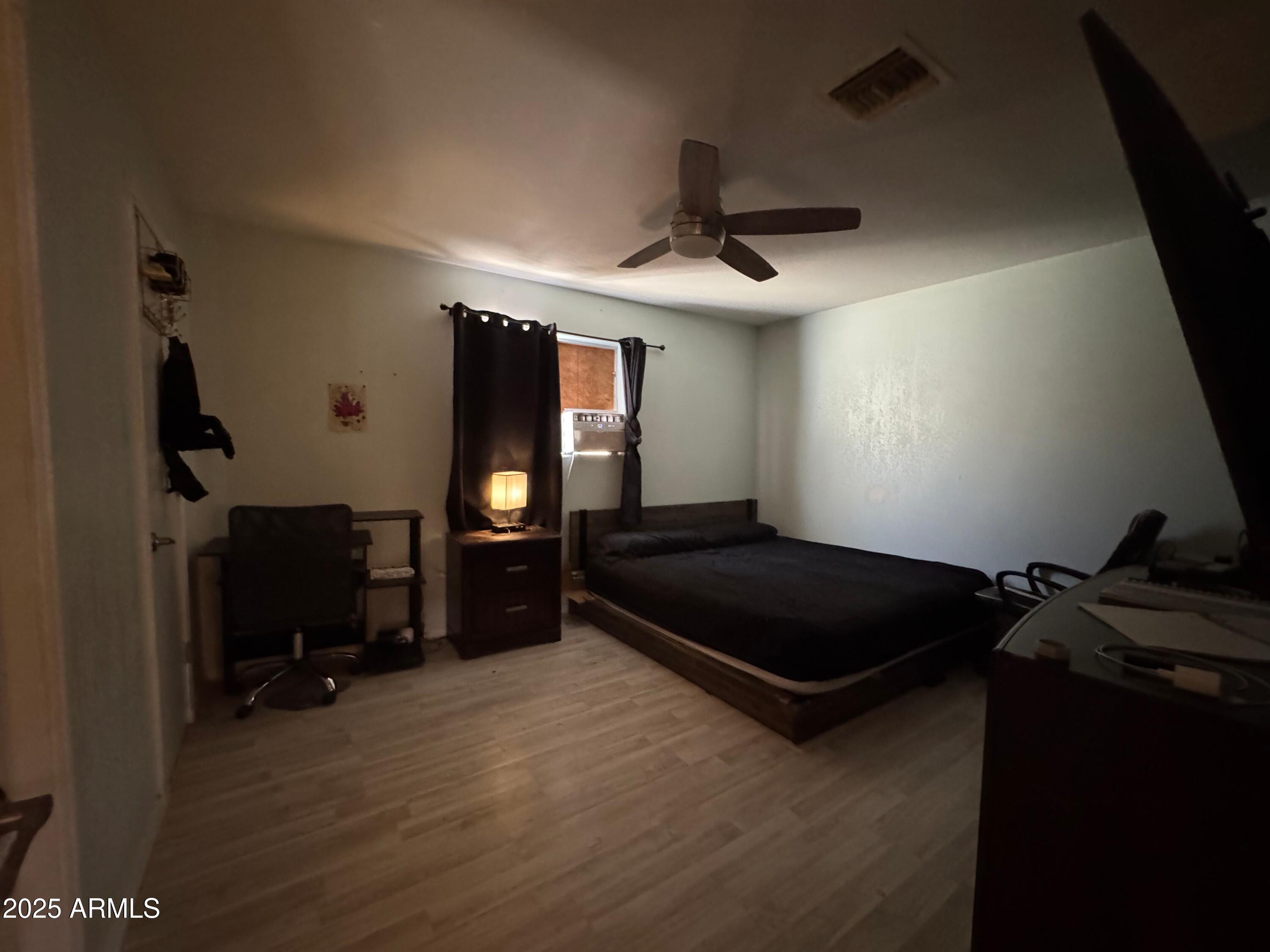 56163 West Papago Road Maricopa, AZ 85139 - Photo 12 of 44 a living room with furniture and a flat screen tv