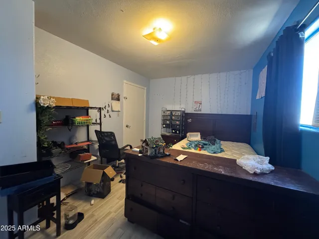 a bedroom with a bed and furniture