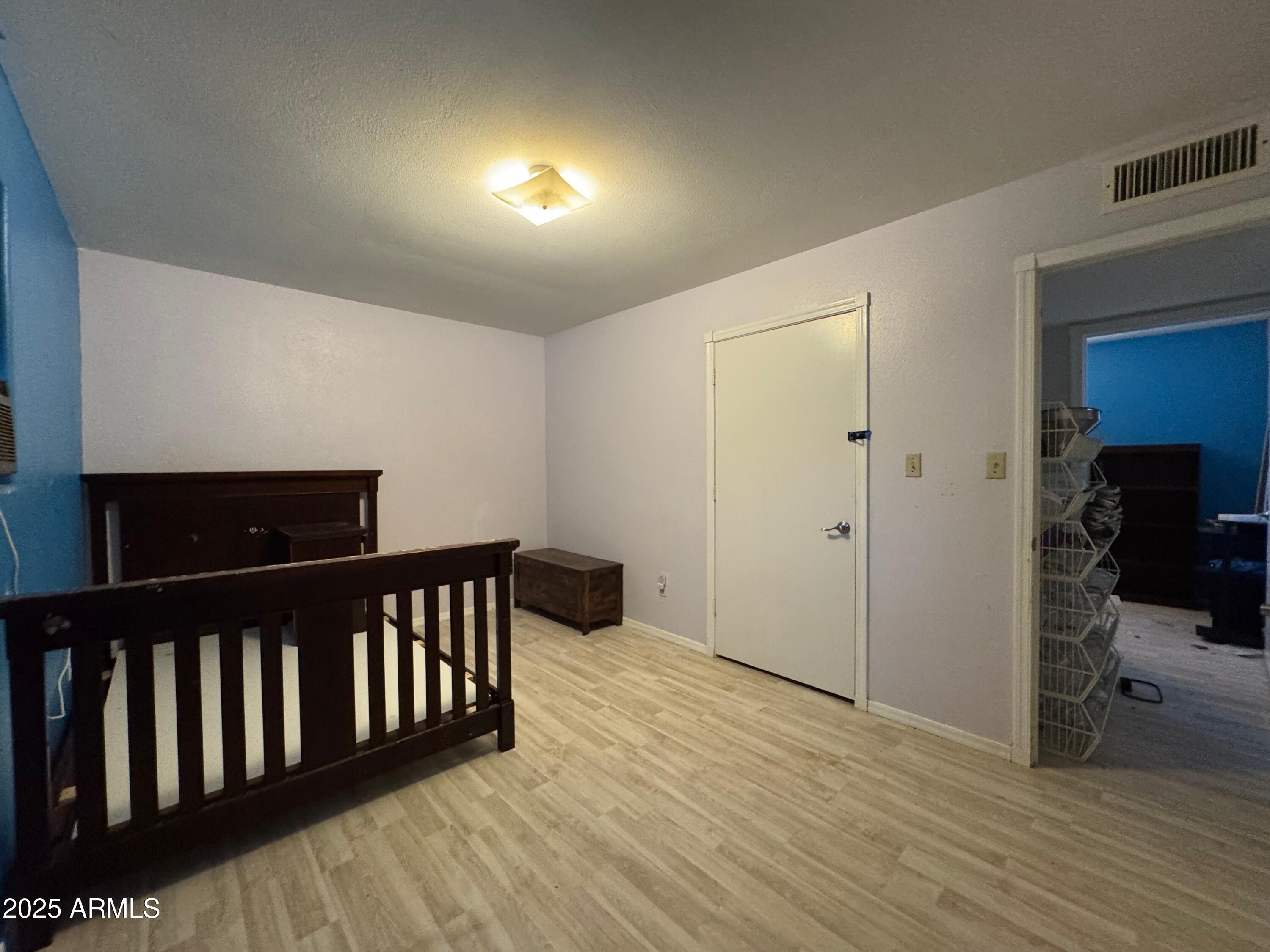 56163 West Papago Road Maricopa, AZ 85139 - Photo 25 of 44 a view of a hallway with wooden floor