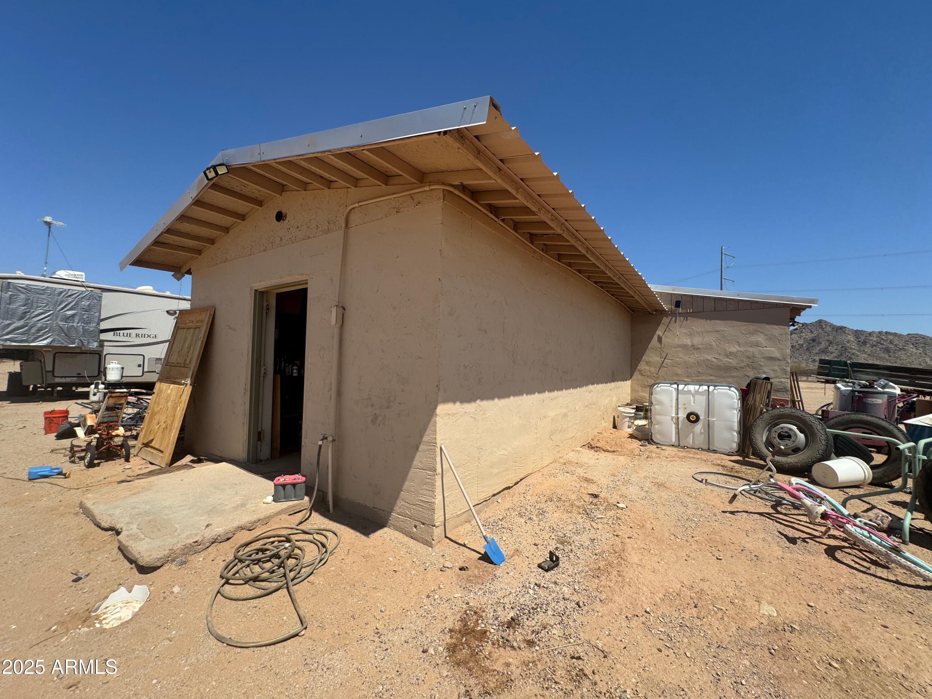 56163 West Papago Road Maricopa, AZ 85139 - Photo 29 of 44 a view of a backyard of the house