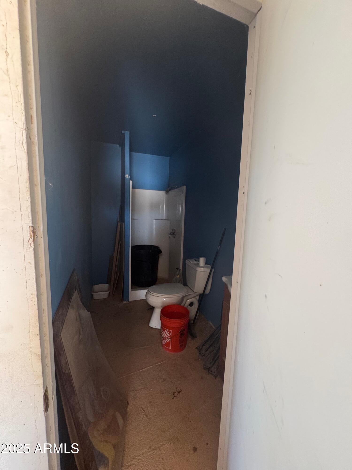 56163 West Papago Road Maricopa, AZ 85139 - Photo 31 of 44 a living room with furniture and a fireplace