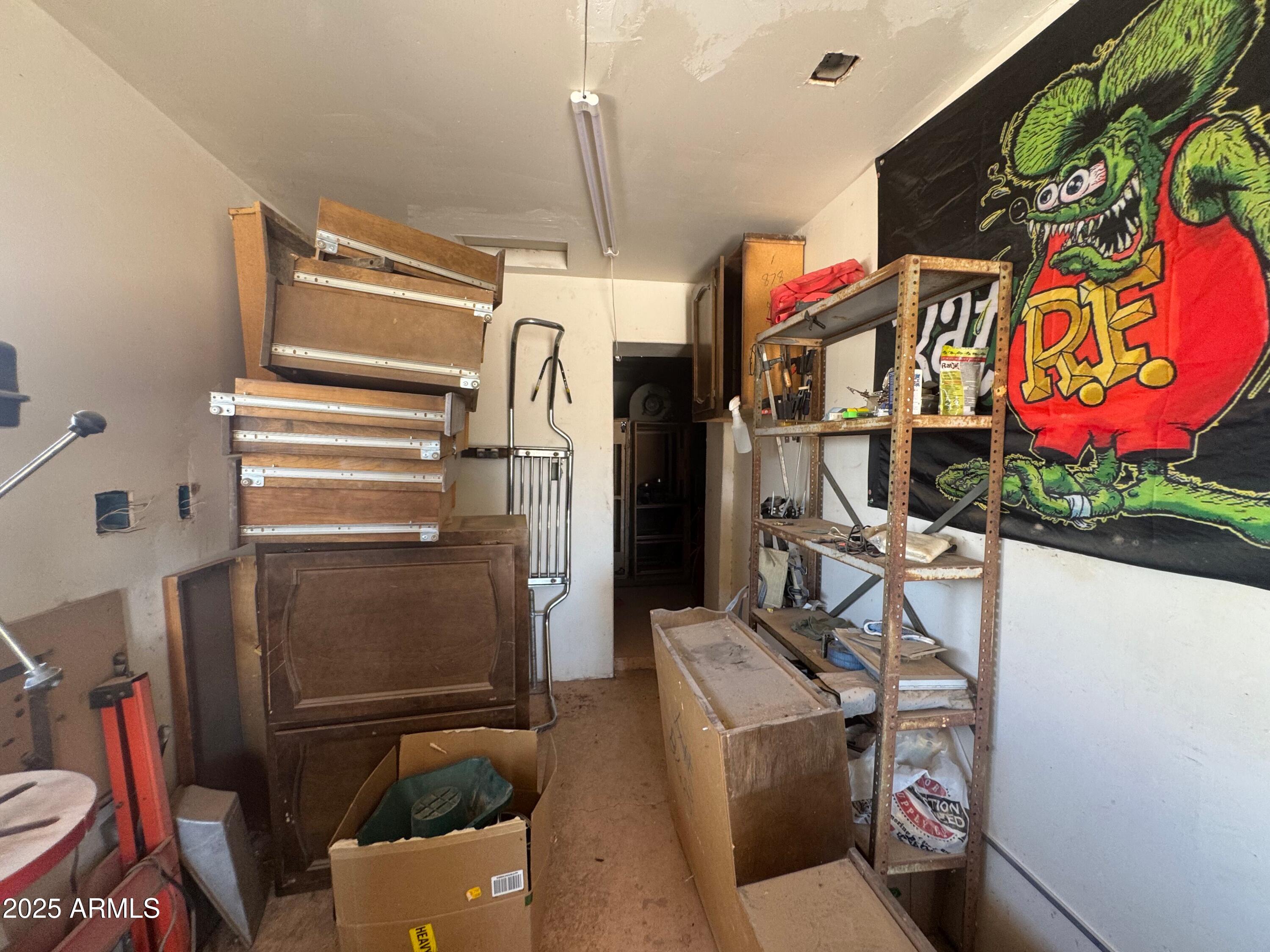 56163 West Papago Road Maricopa, AZ 85139 - Photo 32 of 44 a storage room with washer and dryer