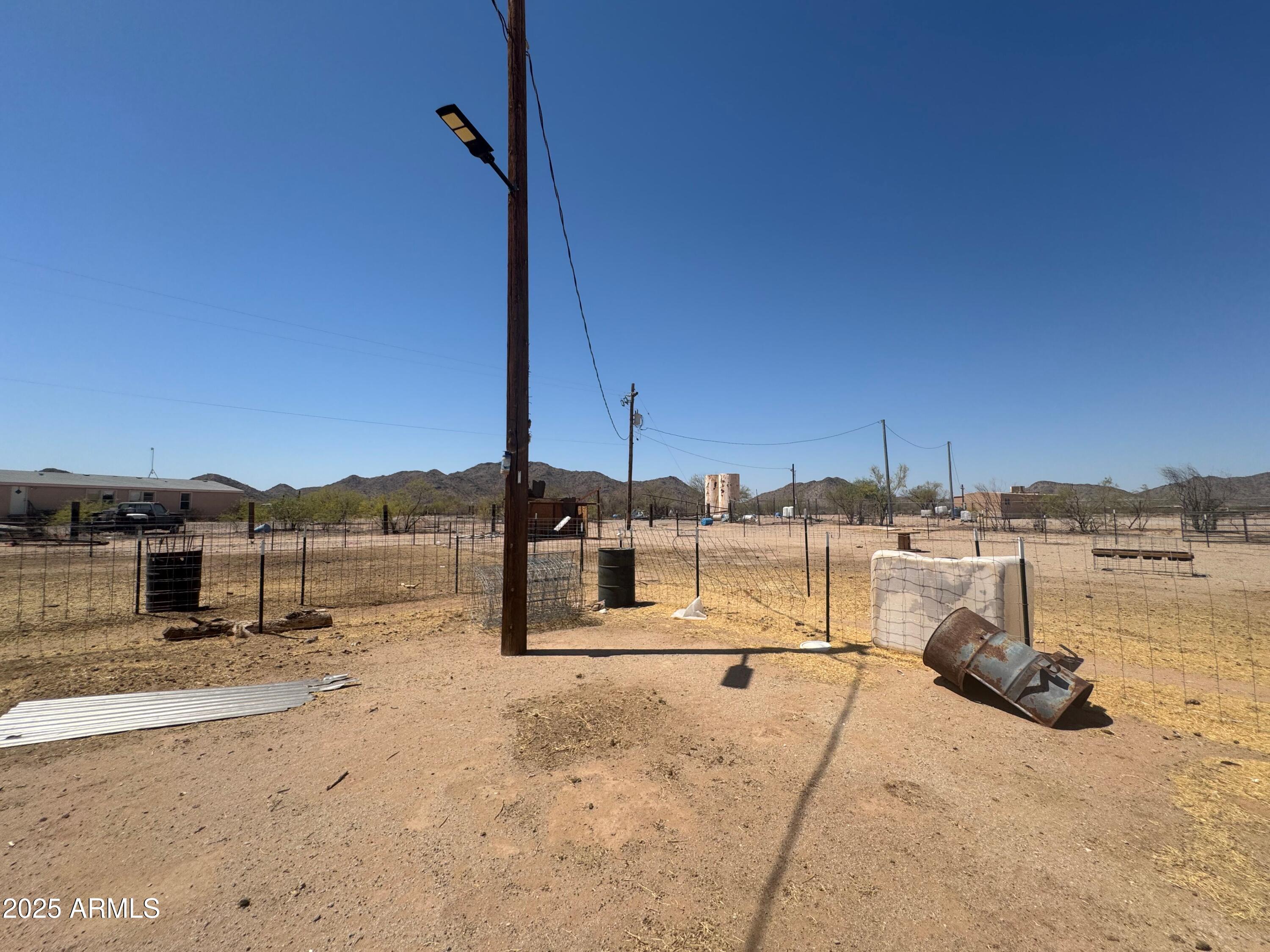56163 West Papago Road Maricopa, AZ 85139 - Photo 42 of 44 a view of a terrace with a bench