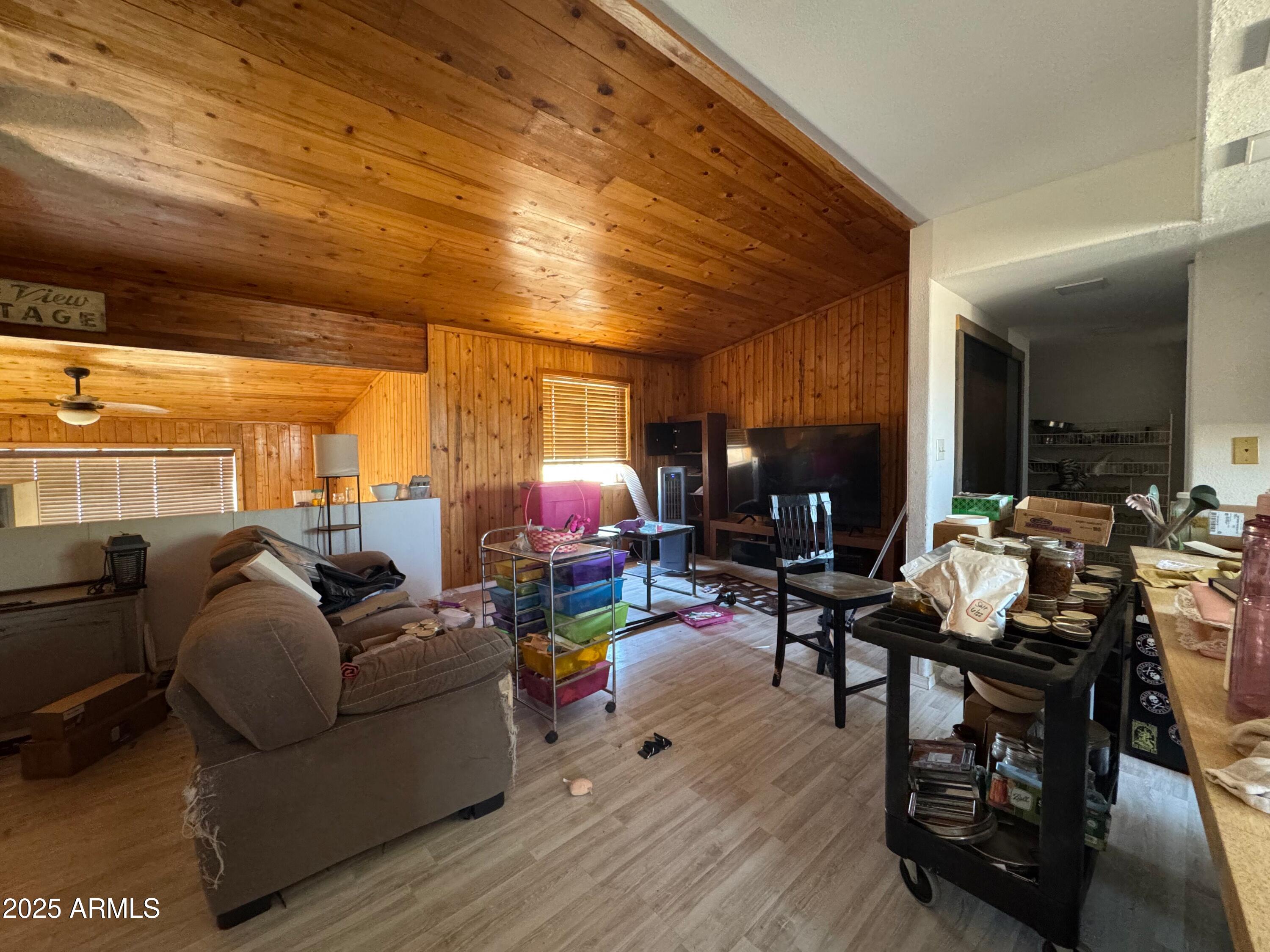 56163 West Papago Road Maricopa, AZ 85139 - Photo 8 of 44 a living room with furniture and a large window