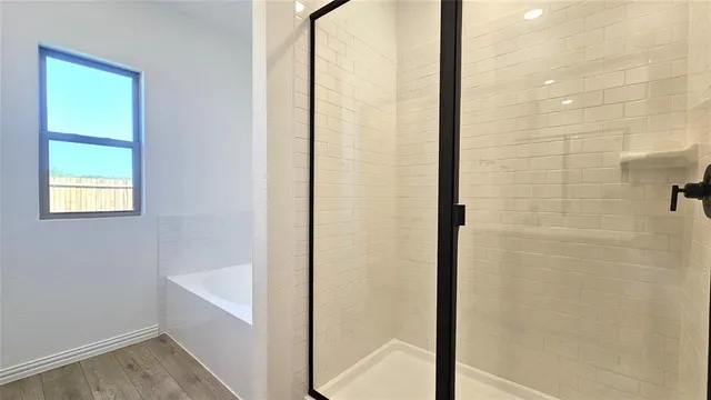 a bathroom with a sink a mirror and a shower