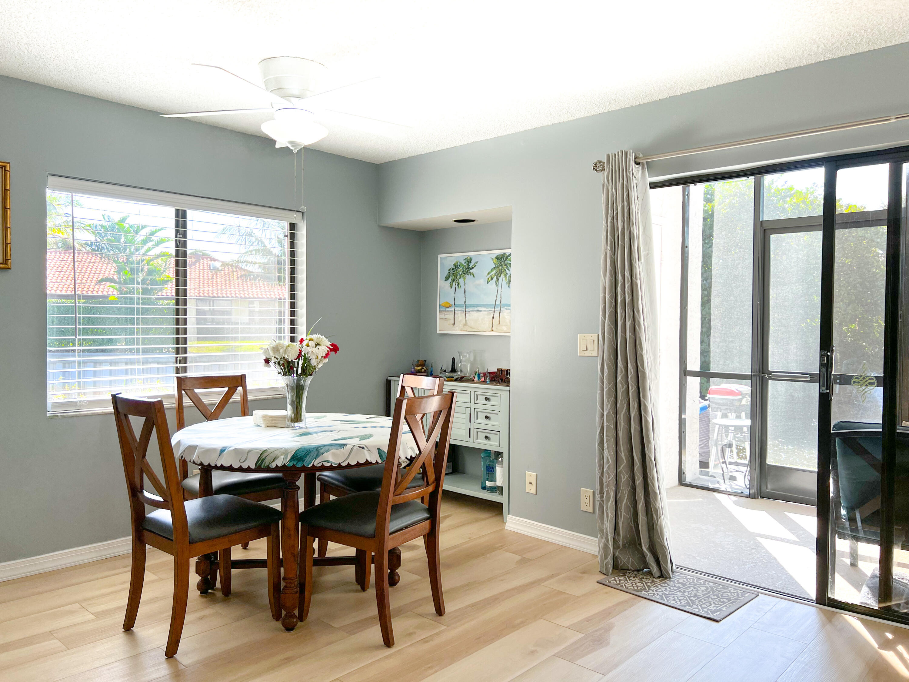 1605 Highway 1, Unit C101 Jupiter, FL 33477 - Photo 17 of 26 a view of a dining room with furniture window and wooden floor