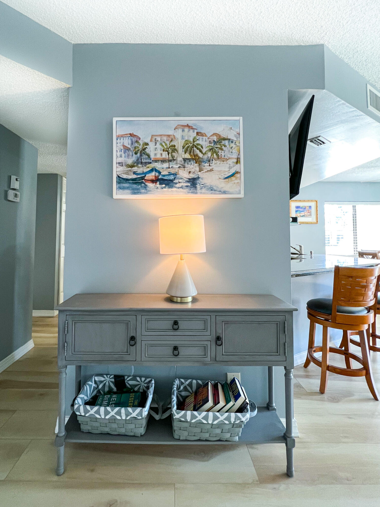 1605 Highway 1, Unit C101 Jupiter, FL 33477 - Photo 18 of 26 a living room with furniture and painting on the wall