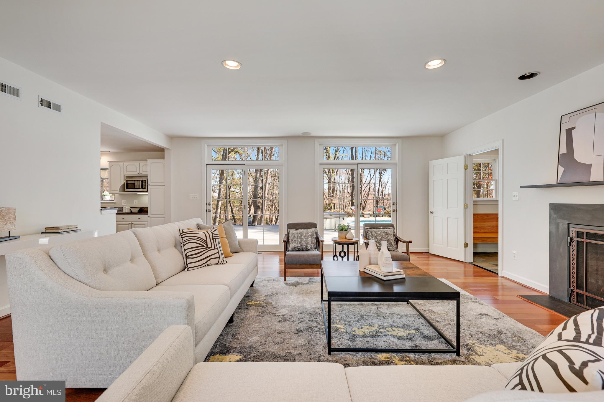 1807 Post Oak Trail Reston, VA 20191 - Photo 11 of 79 a living room with fireplace furniture and a rug
