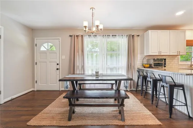 a view of a livingroom with furniture window and wooden floor