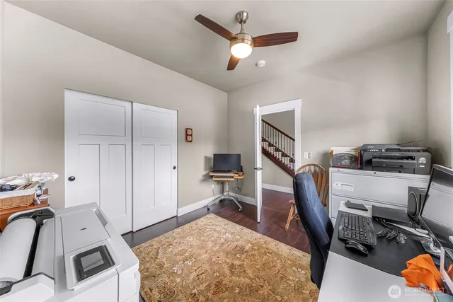 a view of a workspace with furniture and a bedroom