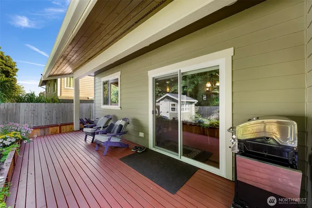 a view of a balcony with couch and wooden floor