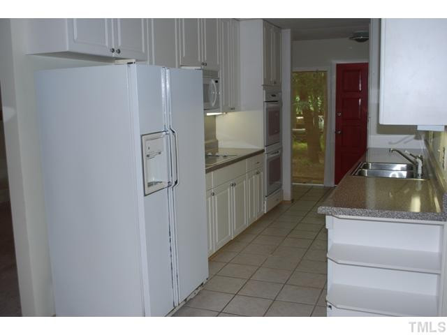 7220 Paddock Drive Raleigh, NC 27613 - Photo 3 of 10 Beautifully updated kitchen with ceramic tile floors and under cabinet lighting. Other
