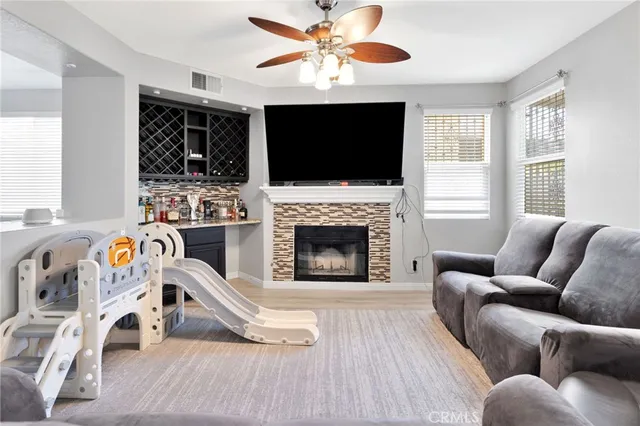 a kitchen with a dining table chairs and white cabinets
