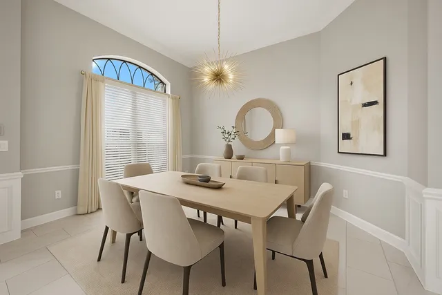 a view of a dining room and a table and chairs