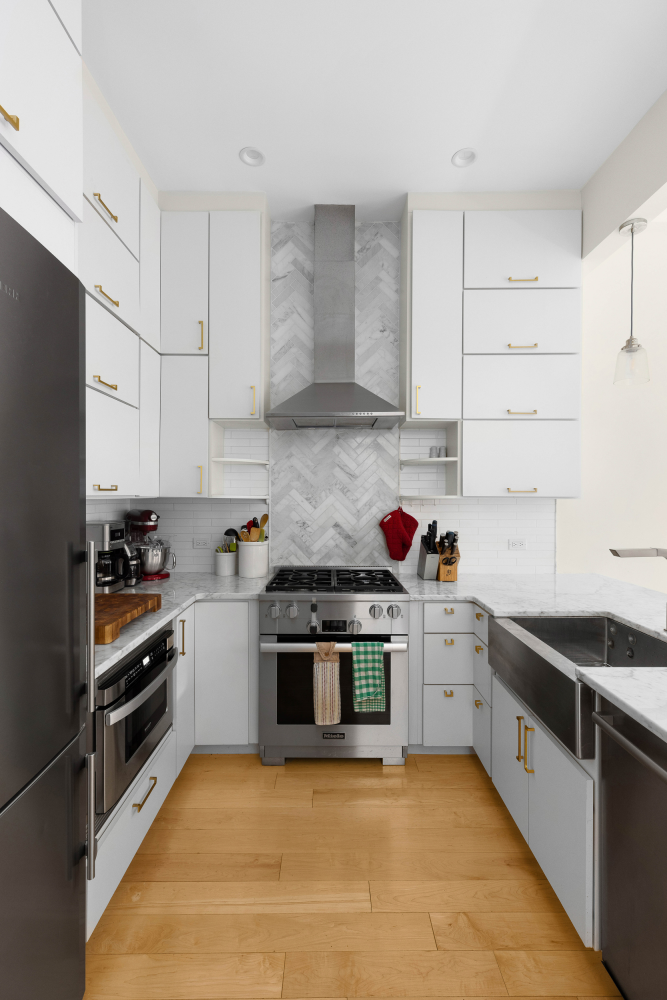 541 Henry Street, Unit D Brooklyn, NY 11231 - Photo 4 of 11 a kitchen with stainless steel appliances granite countertop a stove and a sink