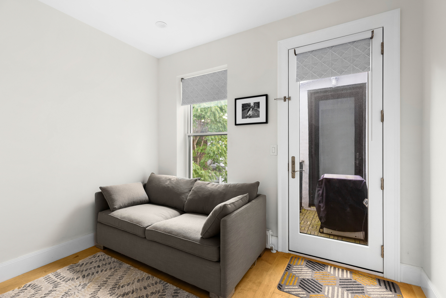 541 Henry Street, Unit D Brooklyn, NY 11231 - Photo 6 of 11 a living room with furniture and a window