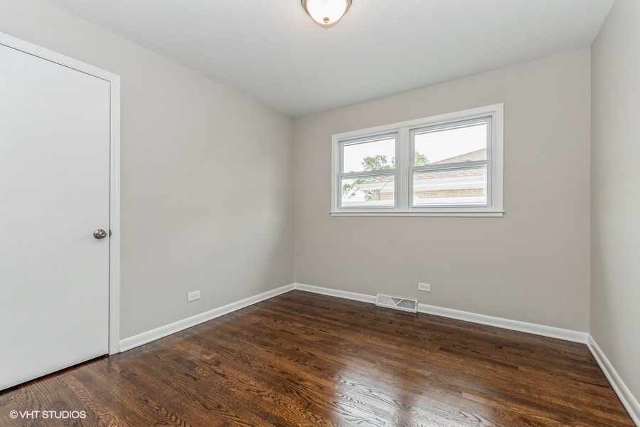 3914 153rd Street Midlothian, IL 60445 - Photo 12 of 17 an empty room with wooden floor and windows
