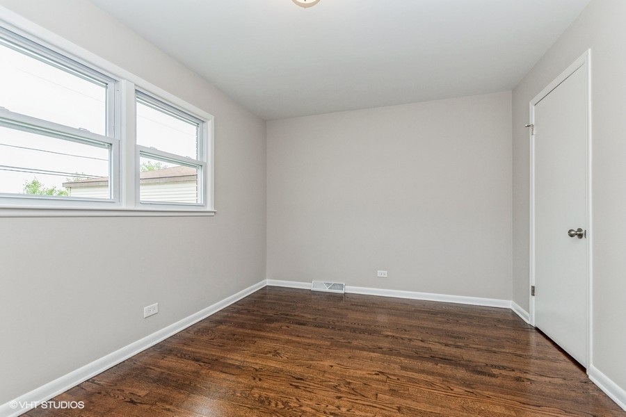 3914 153rd Street Midlothian, IL 60445 - Photo 14 of 17 wooden floor in an empty room with a window