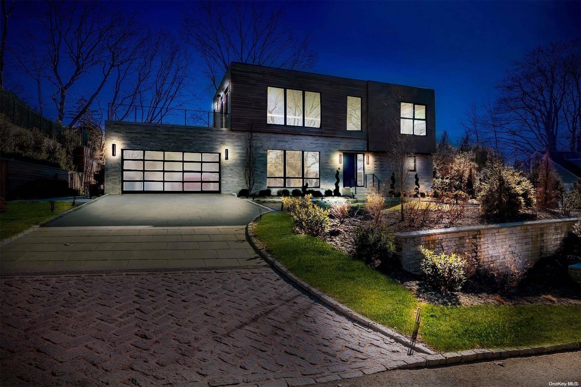 12 Ridgeway Road Port Washington, NY 11050 - Photo 1 of 1 a front view of a house with a yard