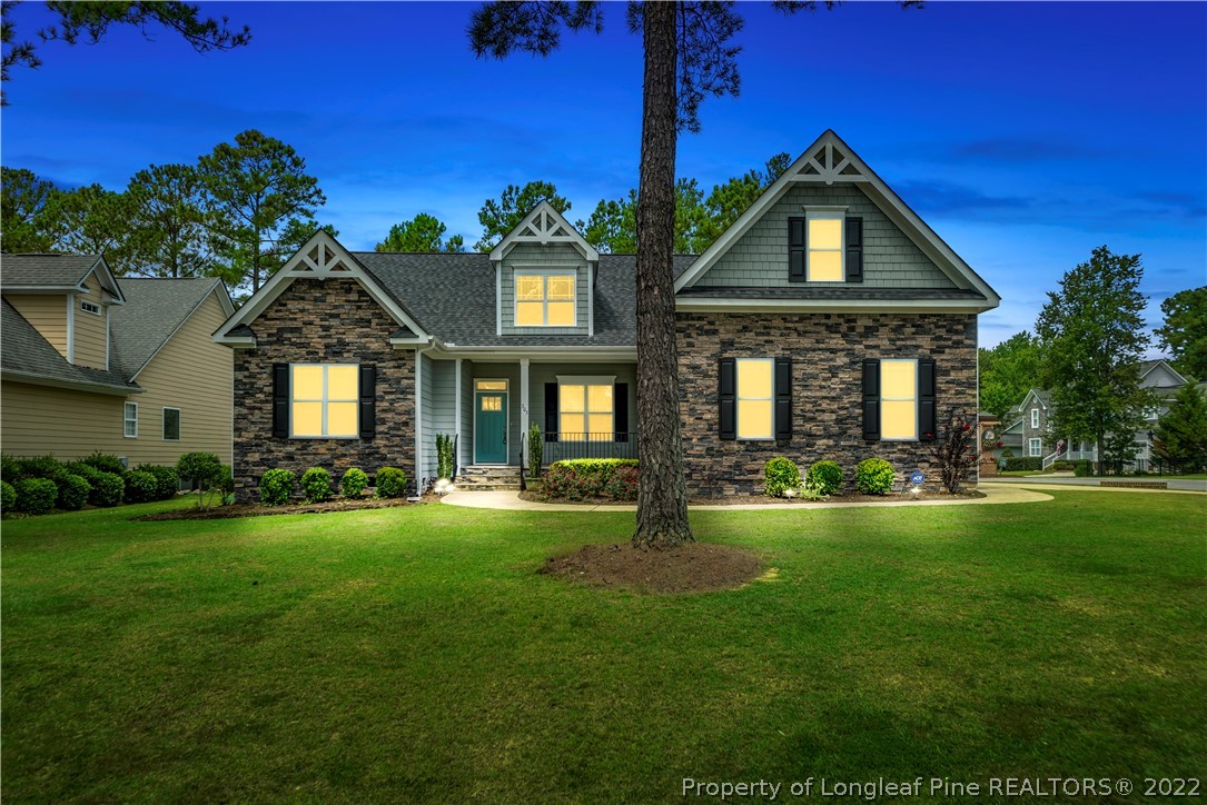 303 Falling Water Road Spring Lake, NC 28390 - Photo 1 of 33 a front view of a house with a yard