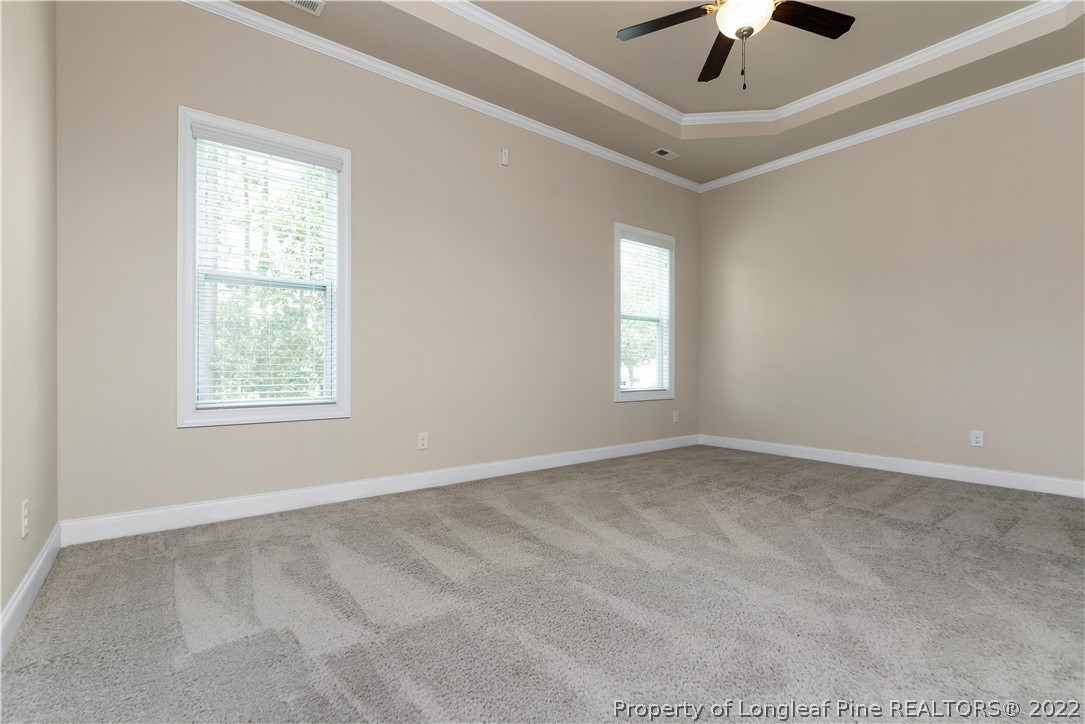 303 Falling Water Road Spring Lake, NC 28390 - Photo 20 of 33 an empty room with a window and a fan