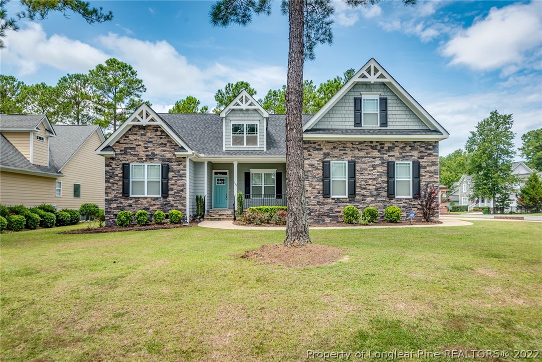 303 Falling Water Road Spring Lake, NC 28390 - Photo 2 of 33 a front view of a house with a yard