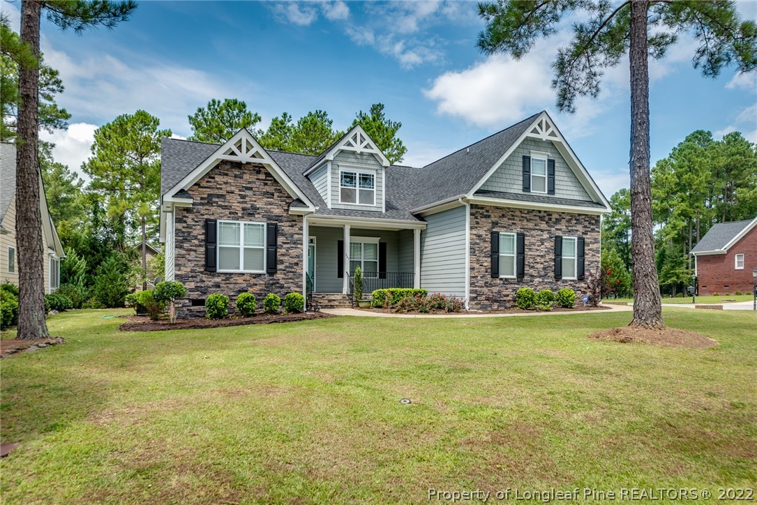 303 Falling Water Road Spring Lake, NC 28390 - Photo 3 of 33 a front view of a house with garden
