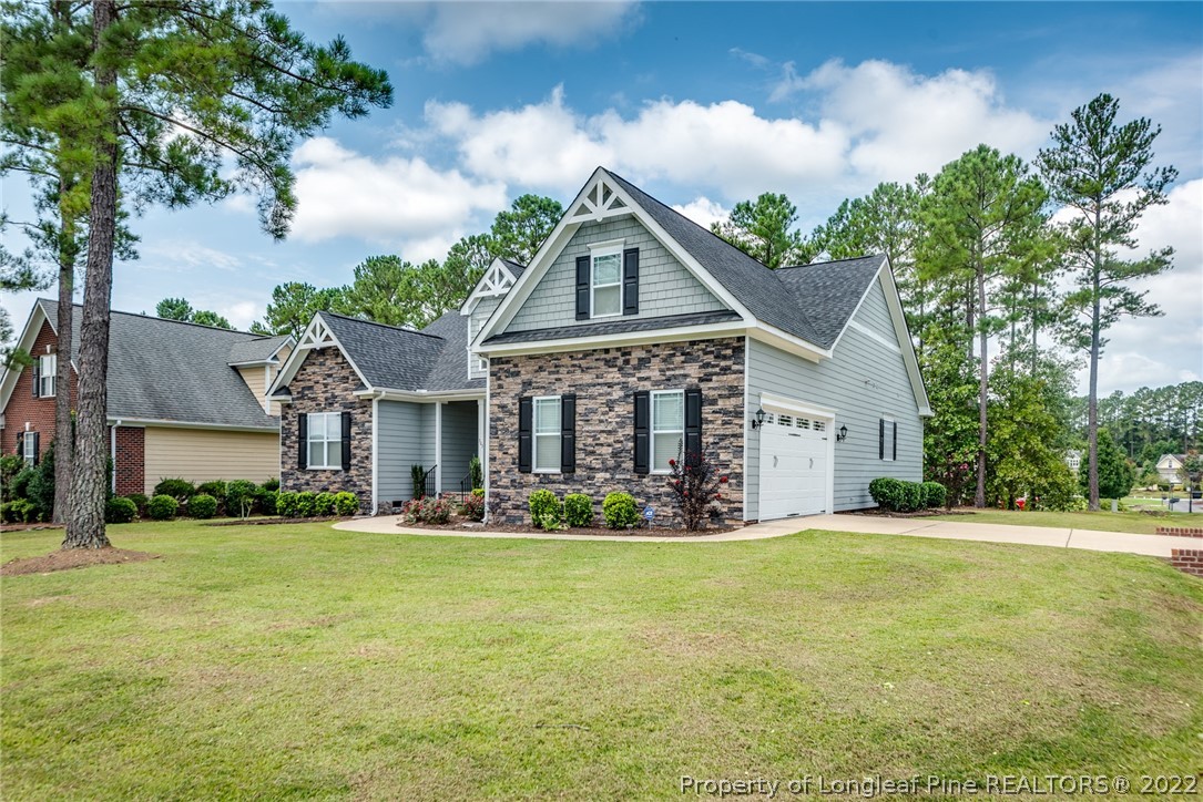 303 Falling Water Road Spring Lake, NC 28390 - Photo 4 of 33 a front view of house with yard and green space