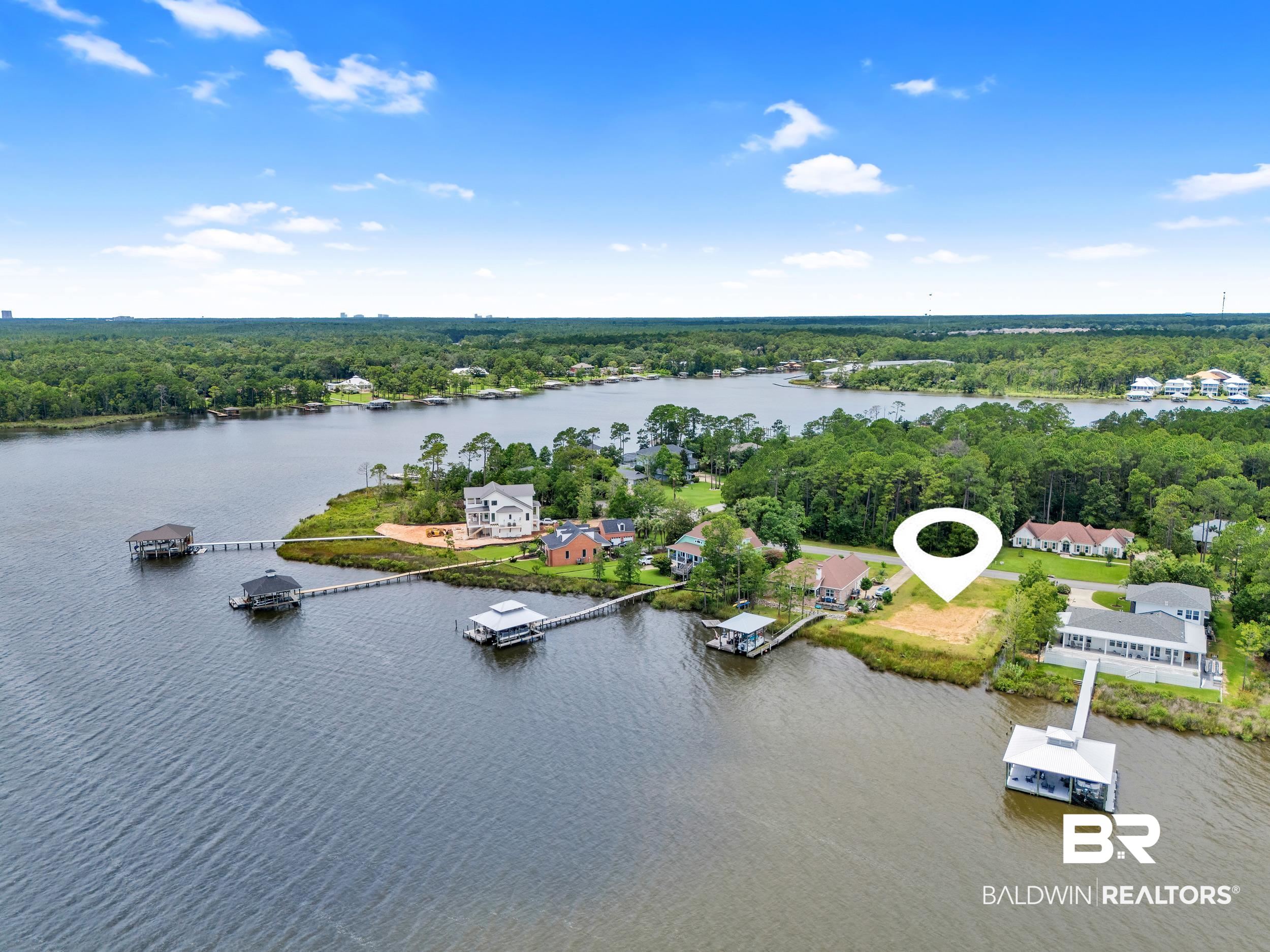 8963 Bay Point Drive Elberta, AL 36530 - Photo 17 of 25 Bird's eye view of a large body of water and a heavily wooded area
