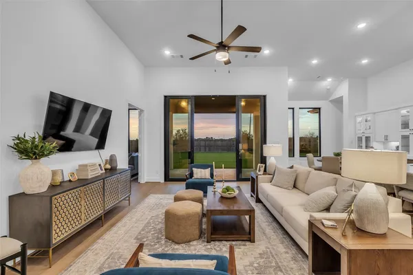 a living room with furniture fireplace and flat screen tv