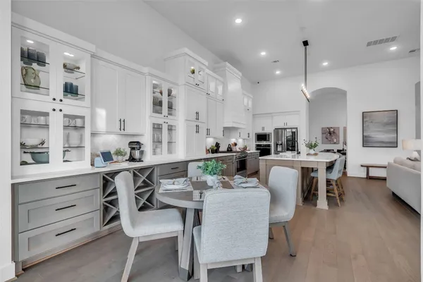 a living room with furniture and a book shelf