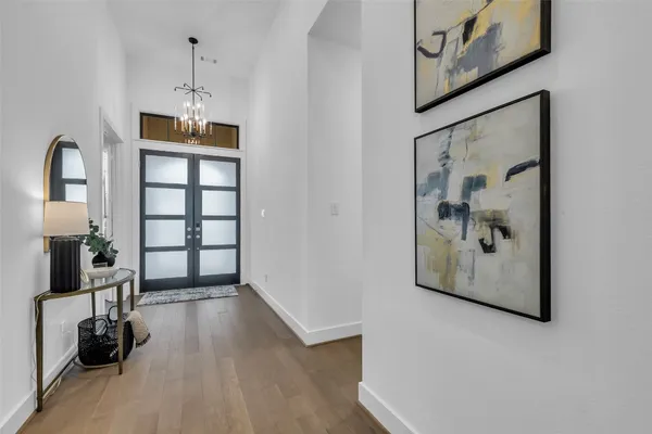 a hallway with wooden floor