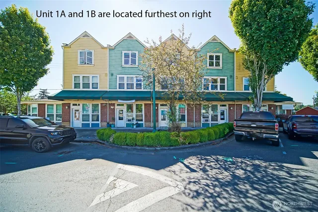 a front view of a house with a garden and patio