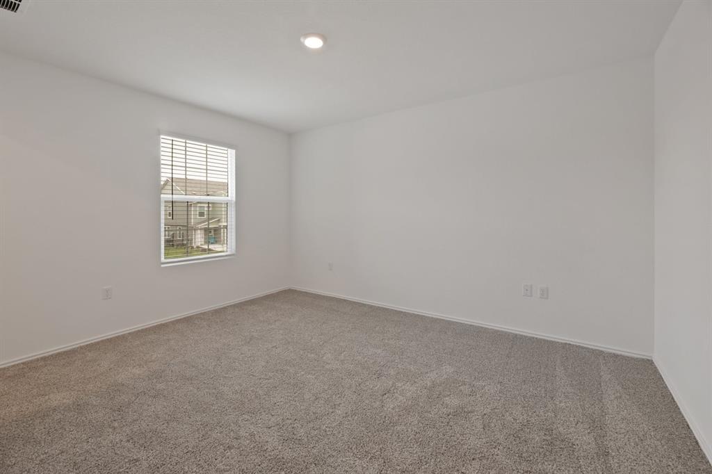 12213 Rising Moon Lane Del Valle, TX 78617 - Photo 6 of 11 an empty room with a window