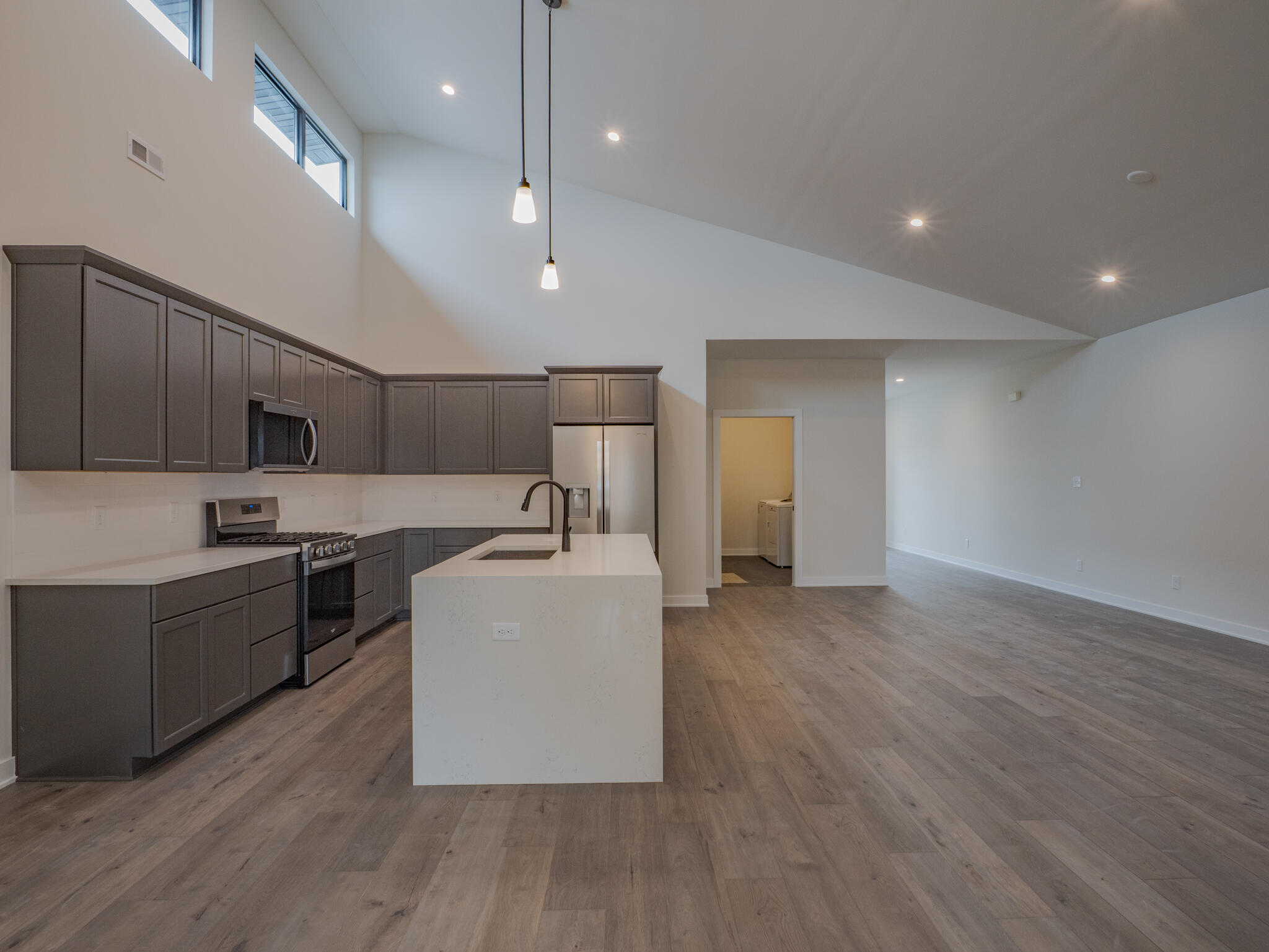 244 Sawgrass Drive Crown Point, IN 46307 - Photo 11 of 19 a large kitchen with stainless steel appliances granite countertop a large center island and a wooden floors