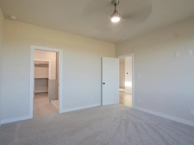 a view of an empty room and a room